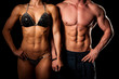 © Samo Trebizan - Fitness couple poses in studio - fit man and woman