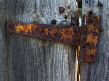 Old Rusty Hinge For A Wooden Door