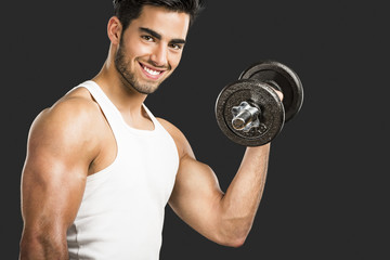 Athletic man lifting weights