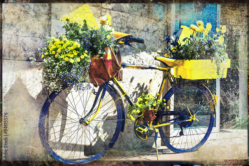 Fototapeta na wymiar vintage bike decorated with flowers, artistic retro picture