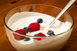 Bowl of yogurt with raspberries and blueberries