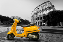 Yellow Vintage Scooter On The Background Of Coliseum