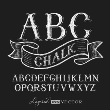 Alphabet hand drawn on chalkboard