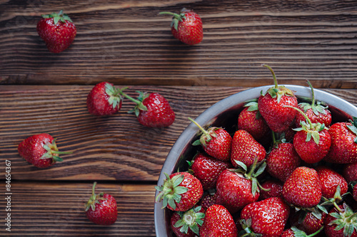 Fresh fruit of strawberries on old wooden table Poster