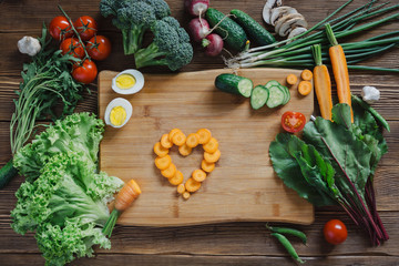 Healthy food and ingredients on rustic wooden background