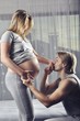 © cirkoglu - Happy future daddy kissing his wife’s hand