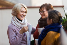 Senior Women Drinking Tea At Balcony