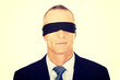 © Piotr Marcinski - Businessman with band on eyes