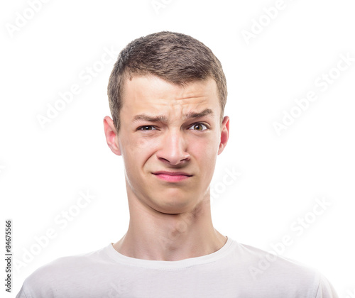 Как выглядит ухмылка на лице Disgusted man. фотография Stock Adobe Stock