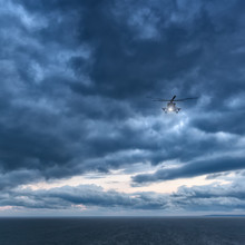 Storm At Sea, Mi-8 Helicopter From Below In Front Dramatic Sky,