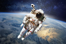 Astronaut In Outer Space With Planet Earth As Backdrop. Elements