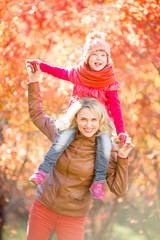 Happy family walking outdoor in fall