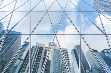 Aufkleber - Reflection of urban skyline on modern office building