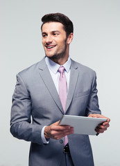 Poster - Happy businessman holding tablet computer