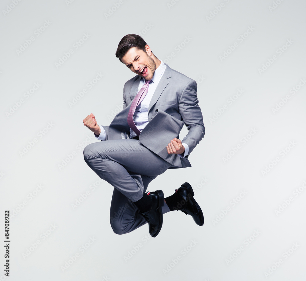 Obraz Funny businessman jumping in air fototapeta, plakat