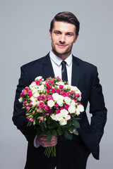 Businessman holding flowers