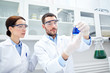 © Syda Productions - young scientists making test or research in lab