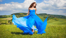 Portrait Of A Beauty Woman In Blue Dress On Italy Hills