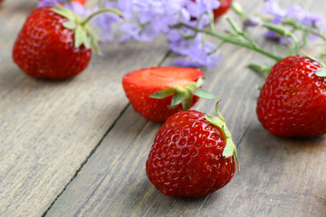 Wall Mural - Fresh strawberries on a wooden background