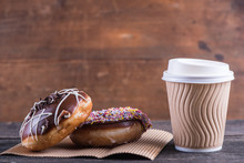 Fresh Artisan Donuts And Take Away Coffee, Wooden Background