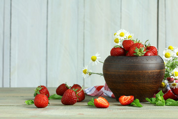 Poster - Fresh strawberries in a bowl  on a wooden background