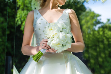 Wall Mural - Beautiful wedding bouquet in hands of the bride