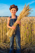 © Sergiy Bykhunenko - Happy farmer's boy with sheaf