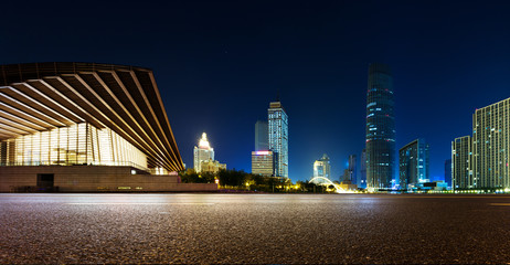 Sticker - Empty asphalt road and modern skyline at night