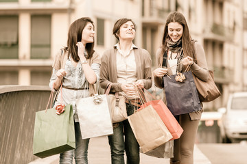 Canvas Print - Three Beautiful Young Women with Shopping Bags