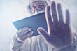 Medical Scientist Reading About MERS Virus on Figital Tablet Com