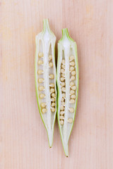 Lady 's Fingers or Okra clean and healthy food on wooden table .