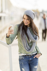 Wall Mural - Young woman taking selfie