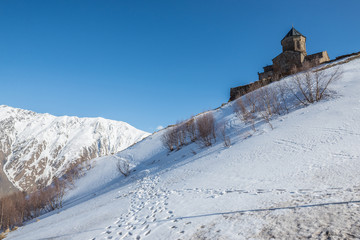 Sticker - 14th century Holy Trinity Church (Tsminda Sameba) near Mount Kazbek in Georgia