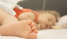 Sleeping Baby With Foot In Focus