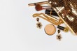 © narstudio - Golden woman accessories. Make up pieces, jewelry and shiny purse. Top view.