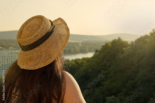Fotografía Woman Standing at Balcony Looking to Distance in Sunset