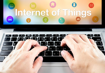 Poster - hand type on laptop with Internet of things (IoT) word and objec