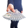 © takoburito - Business man Displaying a Spread of Dollar