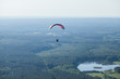 The motorized para glider in the blue sky