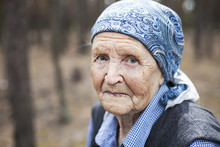 Portrait Of An Aged Woman Smiling Outdoors