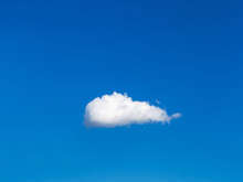 Solitary White Cloud In Blue Sky