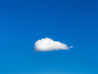 solitary white cloud in blue sky
