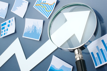 Poster - Looking growth arrow with magnifying glass. Concept image of gro