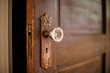 Wooded door with antique door knob. 