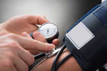 Wall Mural - Doctor Checking Blood Pressure Of A Patient