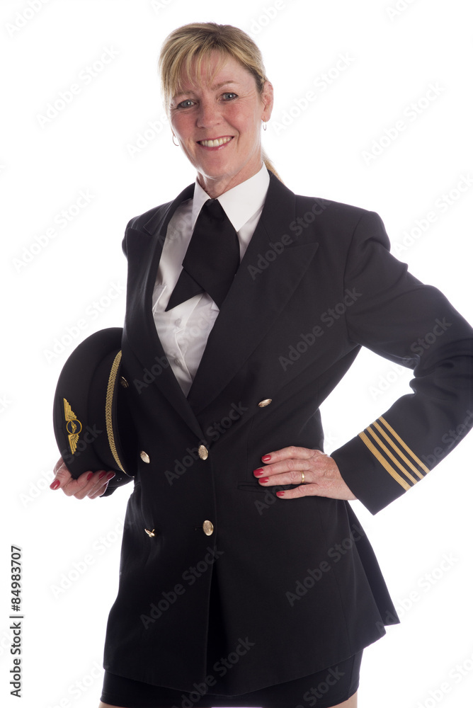 Attractive female airline pilot standing in uniform Stock Photo | Adobe ...