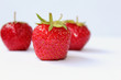 Red strawberries on a white background