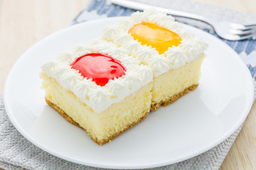 Wall Mural - Cake, orange and strawberry flavored berries in white plate.