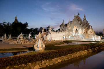 Sticker - Twilight light at Wat Rong Khun (thai name) major religious attractions of Chiang Rai, Thailand.