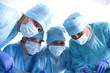 © lenetsnikolai - Team surgeon at work in operating room